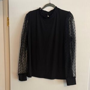 Elegant Black Blouse with Sheer Polka Dot Sleeves